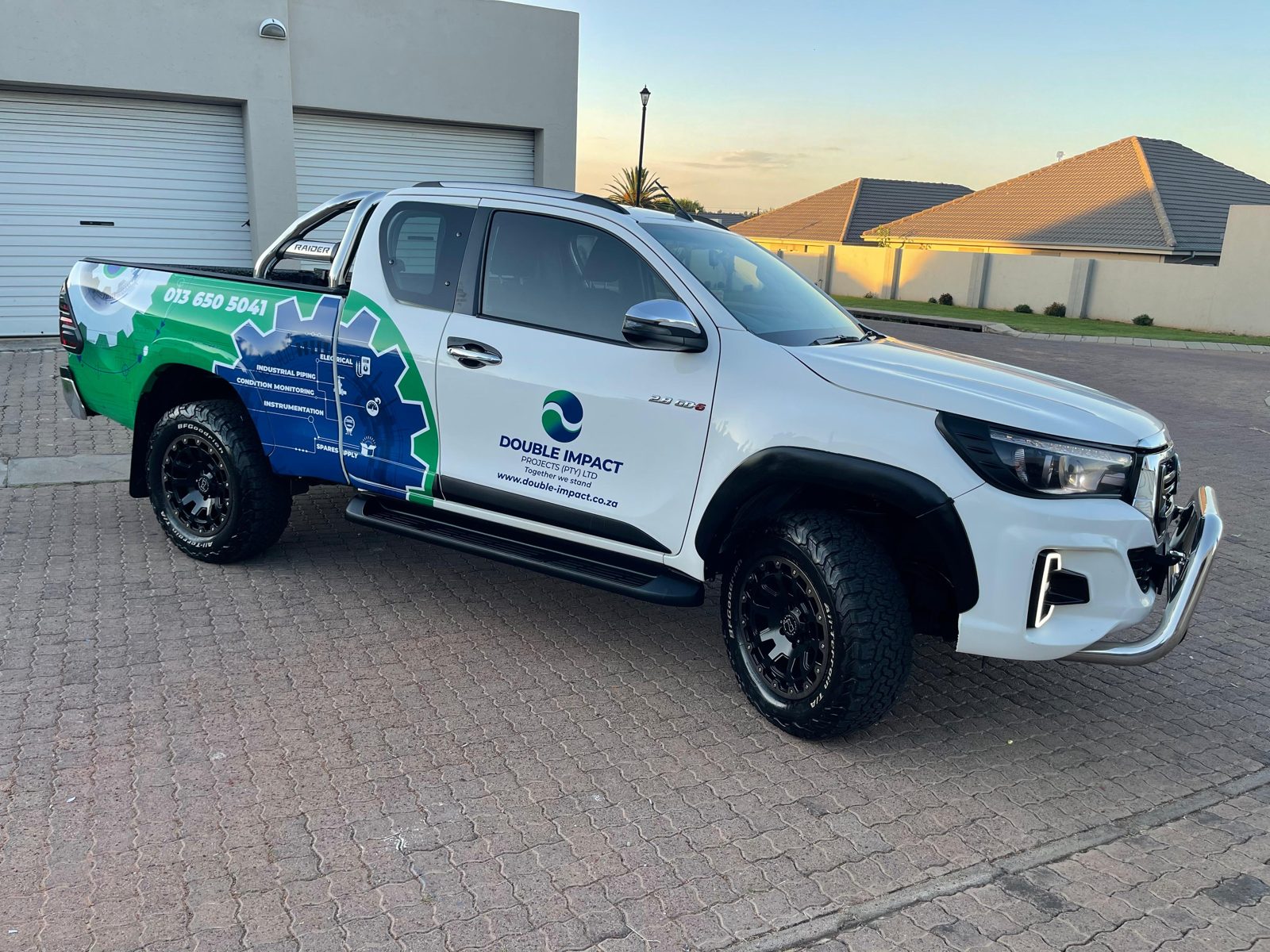 Double Impact Projects branded Toyota Hilux, front