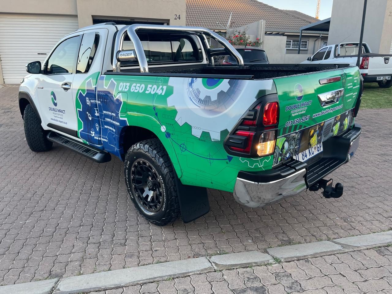 Double Impact Projects branded Toyota Hilux, rear wrap