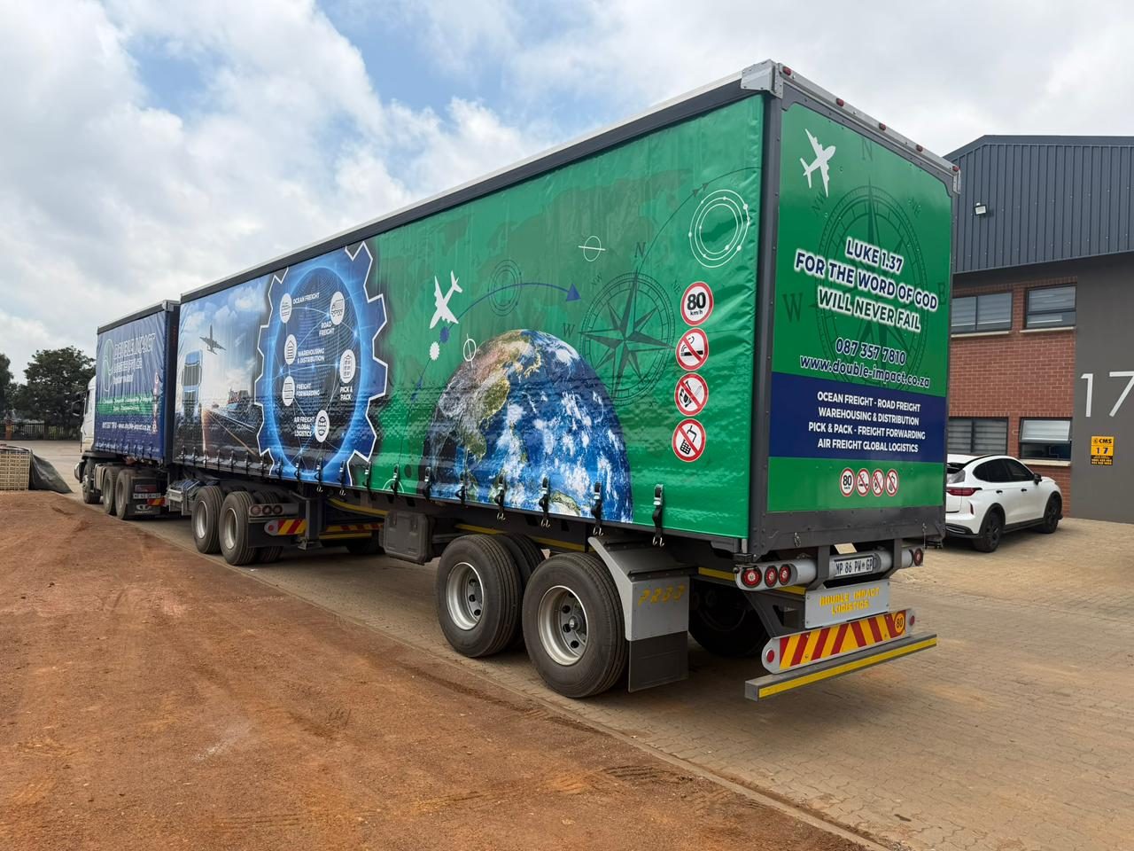 Double Impact Projects trucks on site